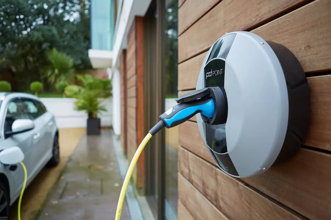 Home EV charger installed on an exterior wall