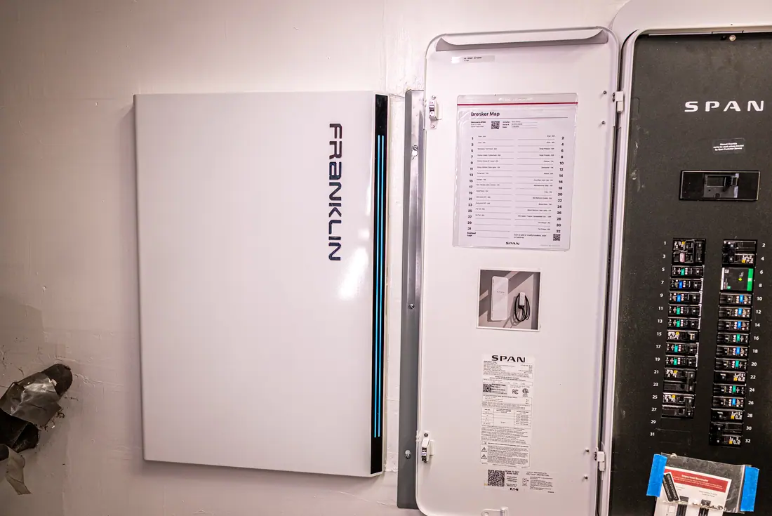 Standby home generator installed beside a house